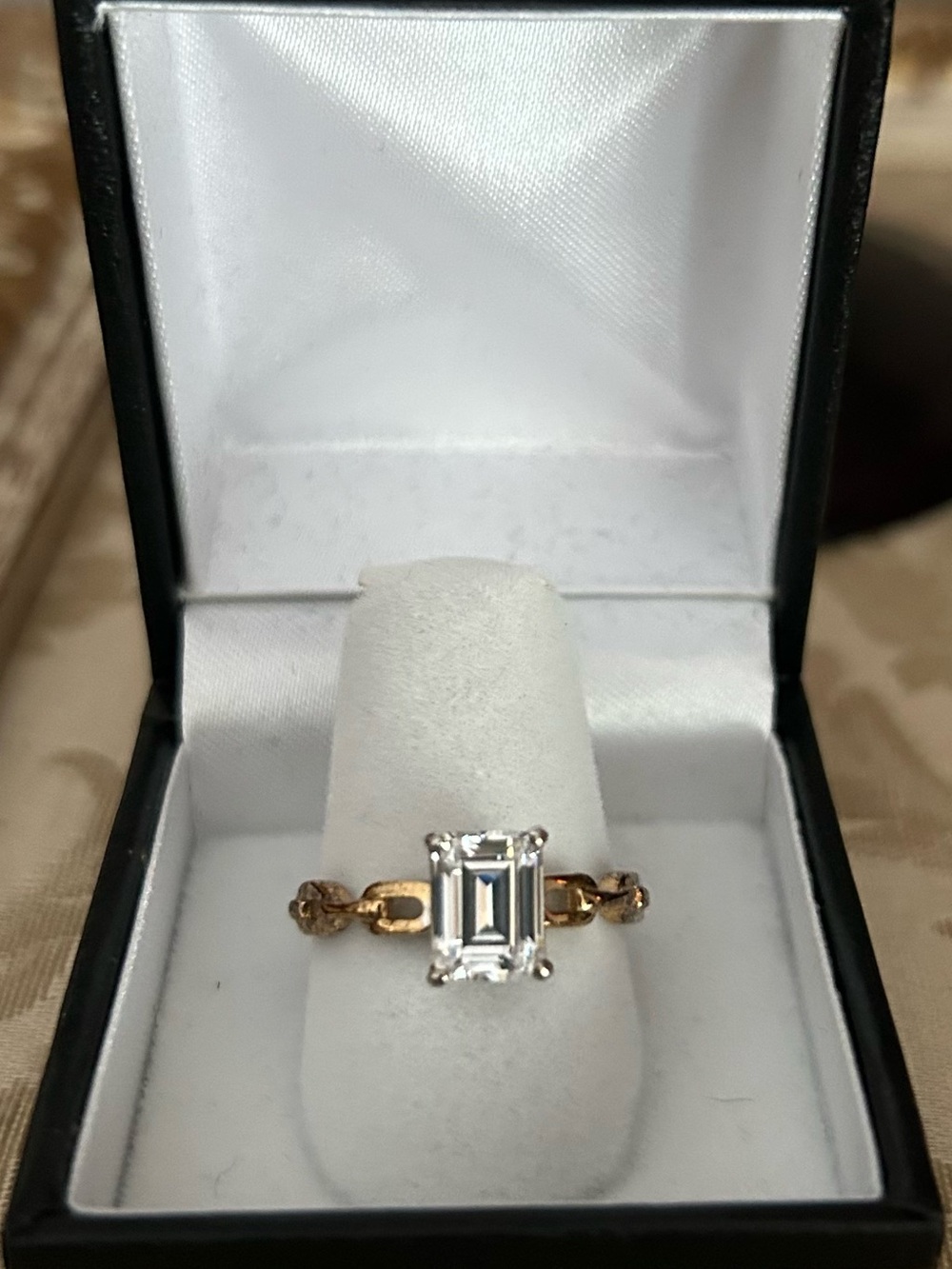 Elegant Gold Ring with Emerald-Cut Clear Stone